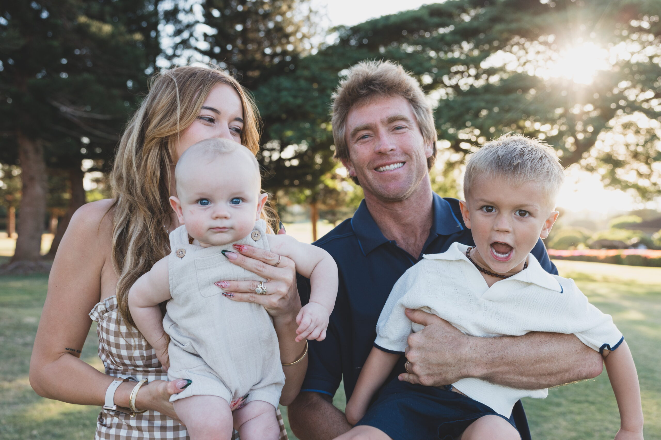 Alyssa and Kevin Sullivan, owners of Maui Aloha Photography, pose with their two young children.<br />
