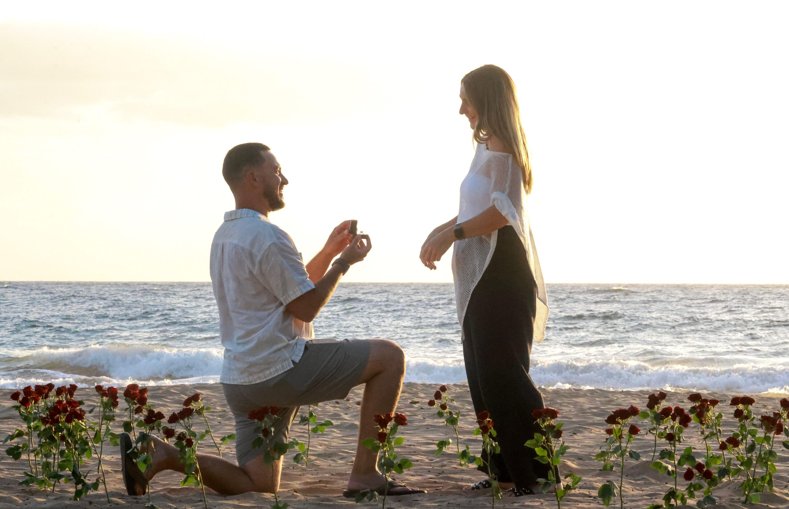 Photo of a couple during their proposal in Lahaina, Maui, HI.
